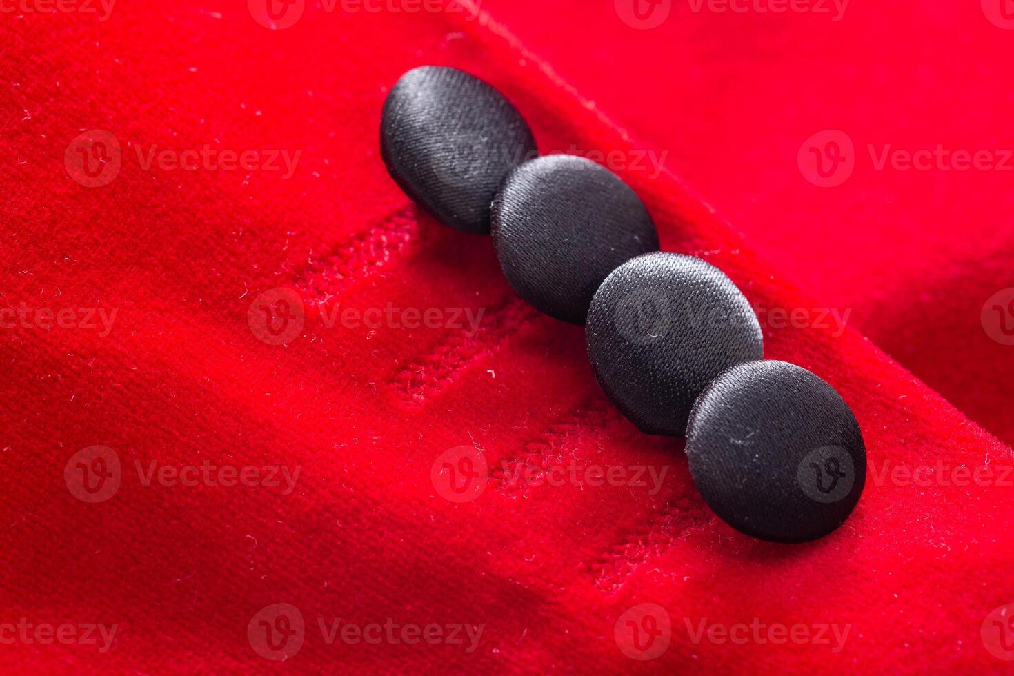 Red stylish jacket with buttons, background. Stylish clothes, macro, elegant photo