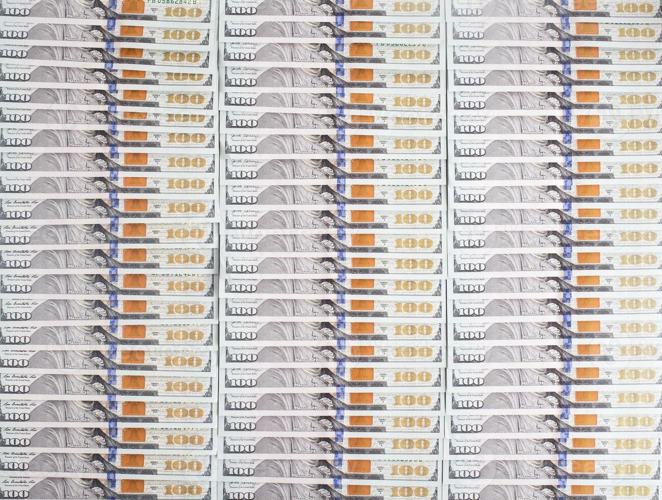 Lots of 100 us dollar banknotes, background. Business and currency exchange concept, copy space for text photo