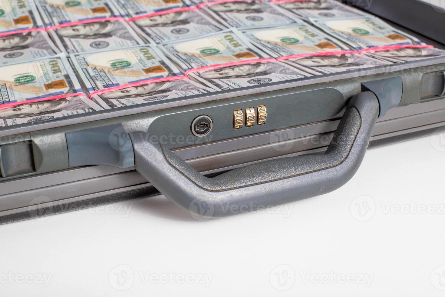 Case with money bills of 100 dollars on a white background. Wealth, financial investment and investment concept, copy space for text. Criminal photo