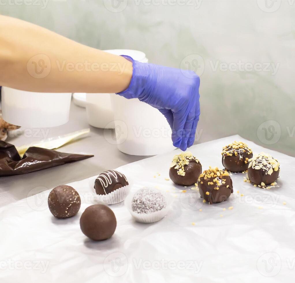 Making chocolate cakes in the form of a bowl with nuts in the confectionery industry, traditional dessert photo