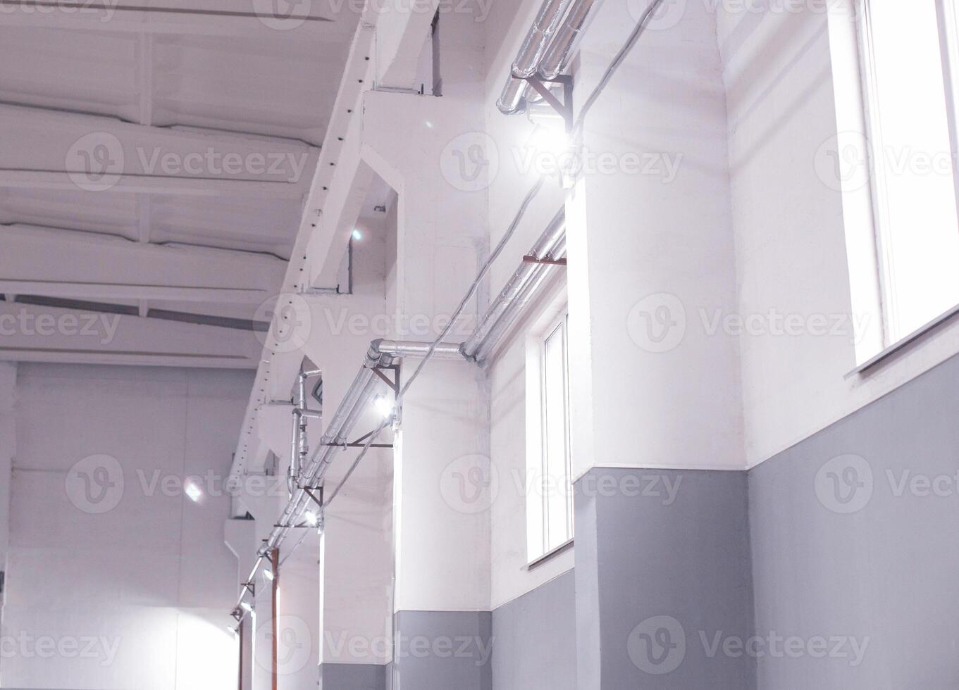 Lighting with modern LED floodlights in the production room for storing raw materials. Indoors photo