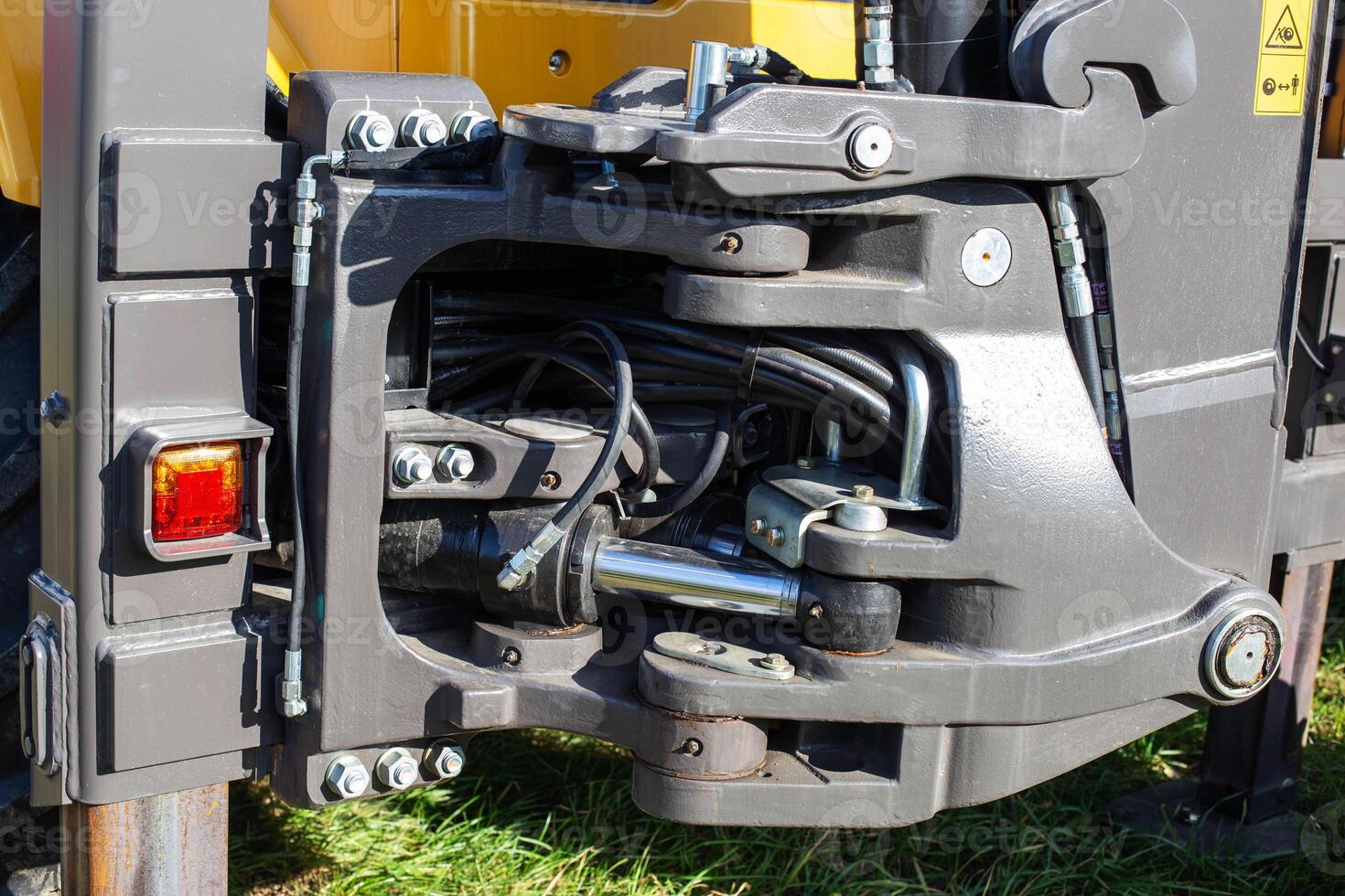 Hydraulic mechanism on construction equipment for driving a bucket on an excavator, industry, background photo