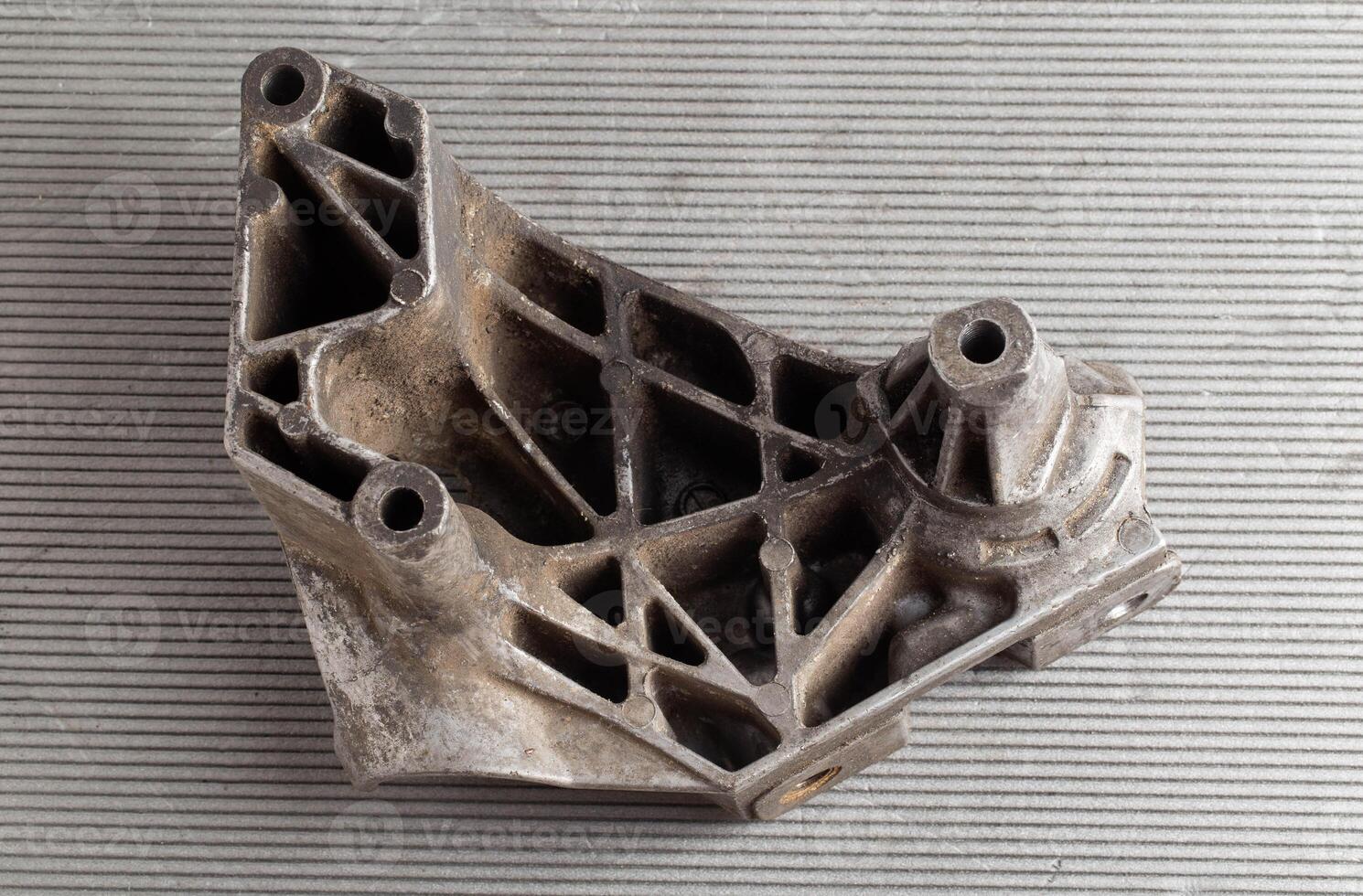 Aluminum pad and car engine mount, close-up photo
