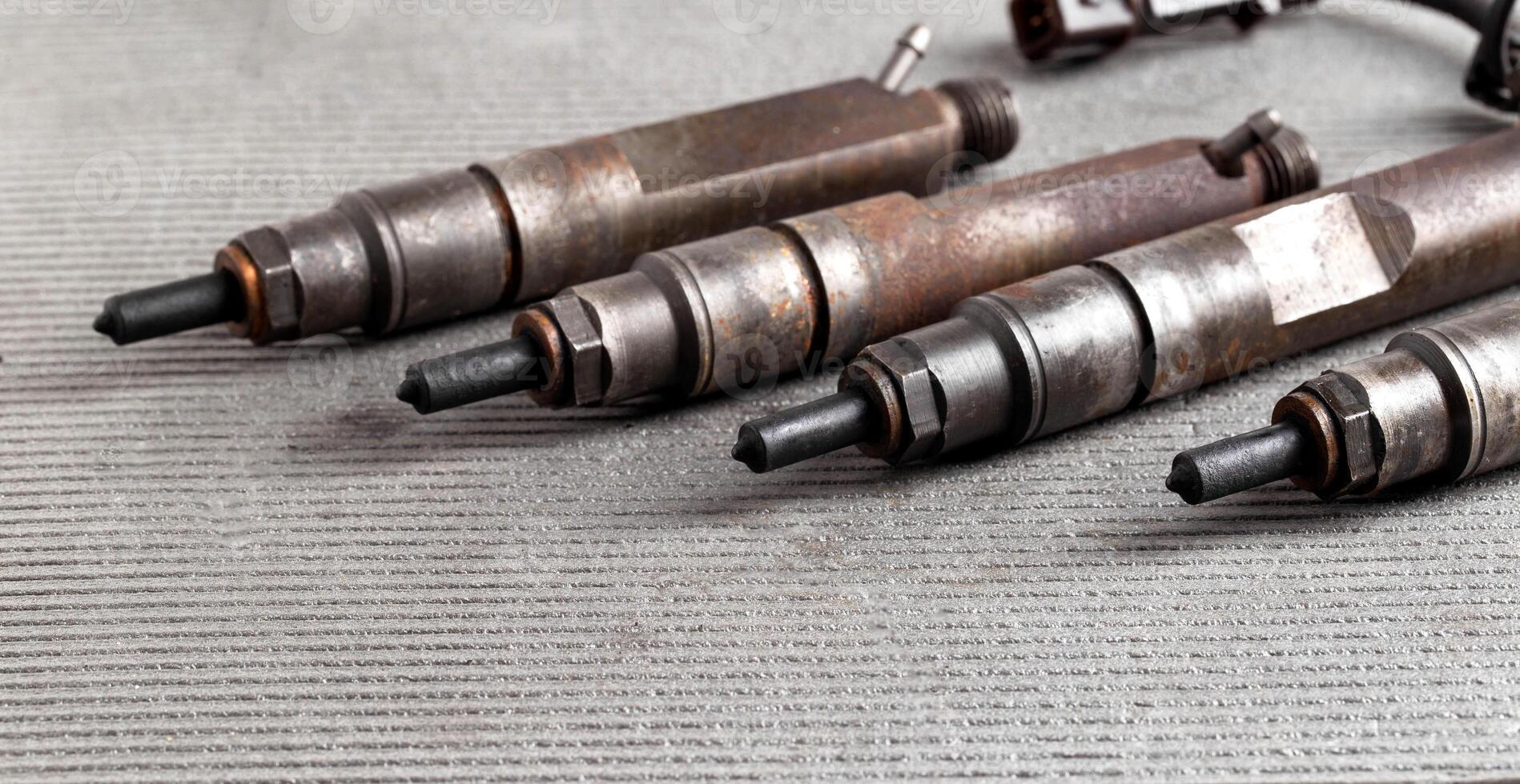 Mechanical injectors from a diesel engine, close-up. Fuel atomization, diesel fuel quality. Close-up, copy space for text photo