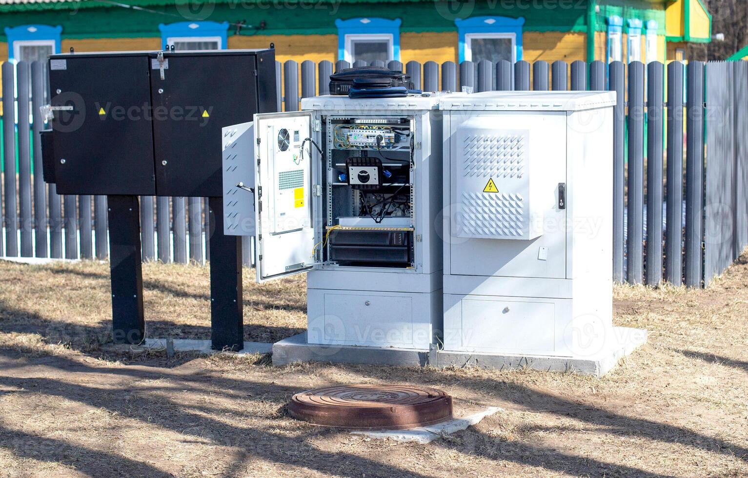 Electric cabinet with electricity on the background of a private house. Power supply of the village house, industry photo