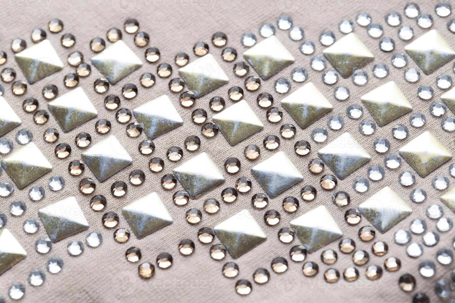 Silver sequins and rhinestones on clothes, macro. Garments, fashionable photo