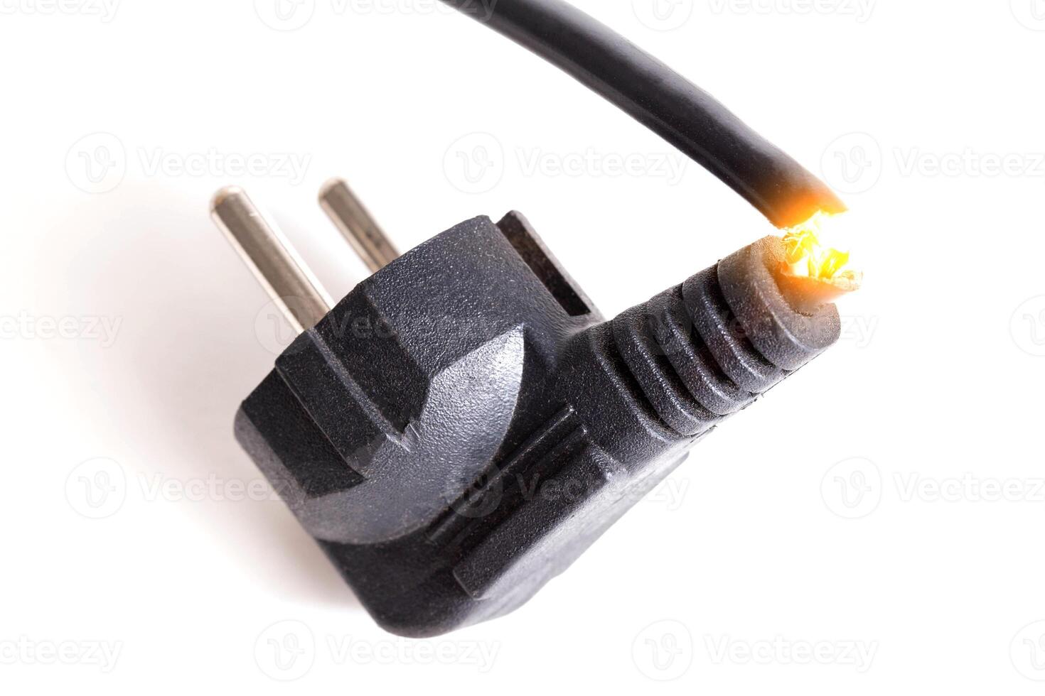 Broken electrical wire with a plug for an outlet on a white background. Electricity fire photo
