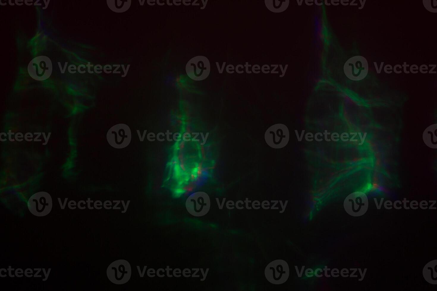 Blurred lens flare. Defocused colorful lights. Shiny glowing spots, abstract background and texture photo
