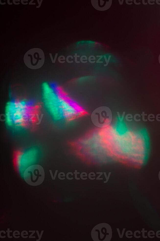 Blurred lens flare. Defocused colorful lights. Shiny glowing spots, abstract background and texture photo