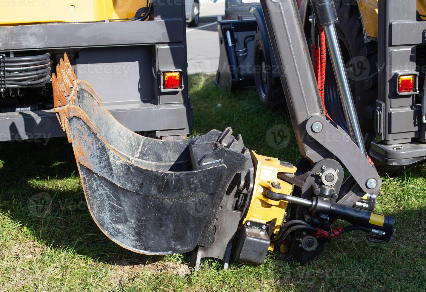 Swivel, modern hydraulic excavator bucket for soil loading, industry, equipment photo