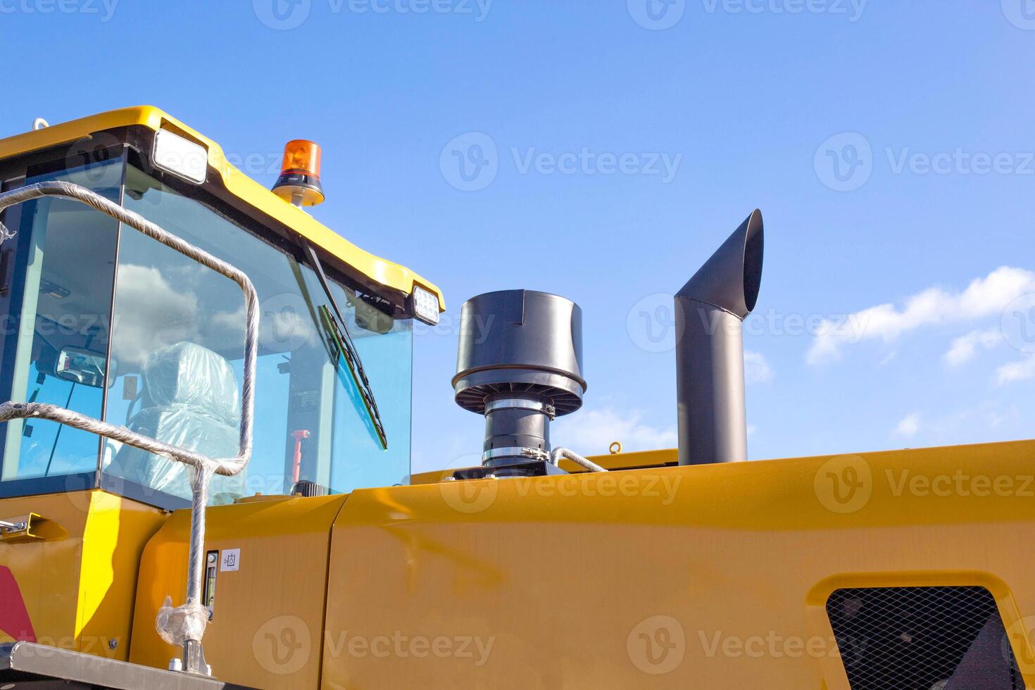 new modern grader for planning and moving soil. Road construction and leveling, industry, copy space photo
