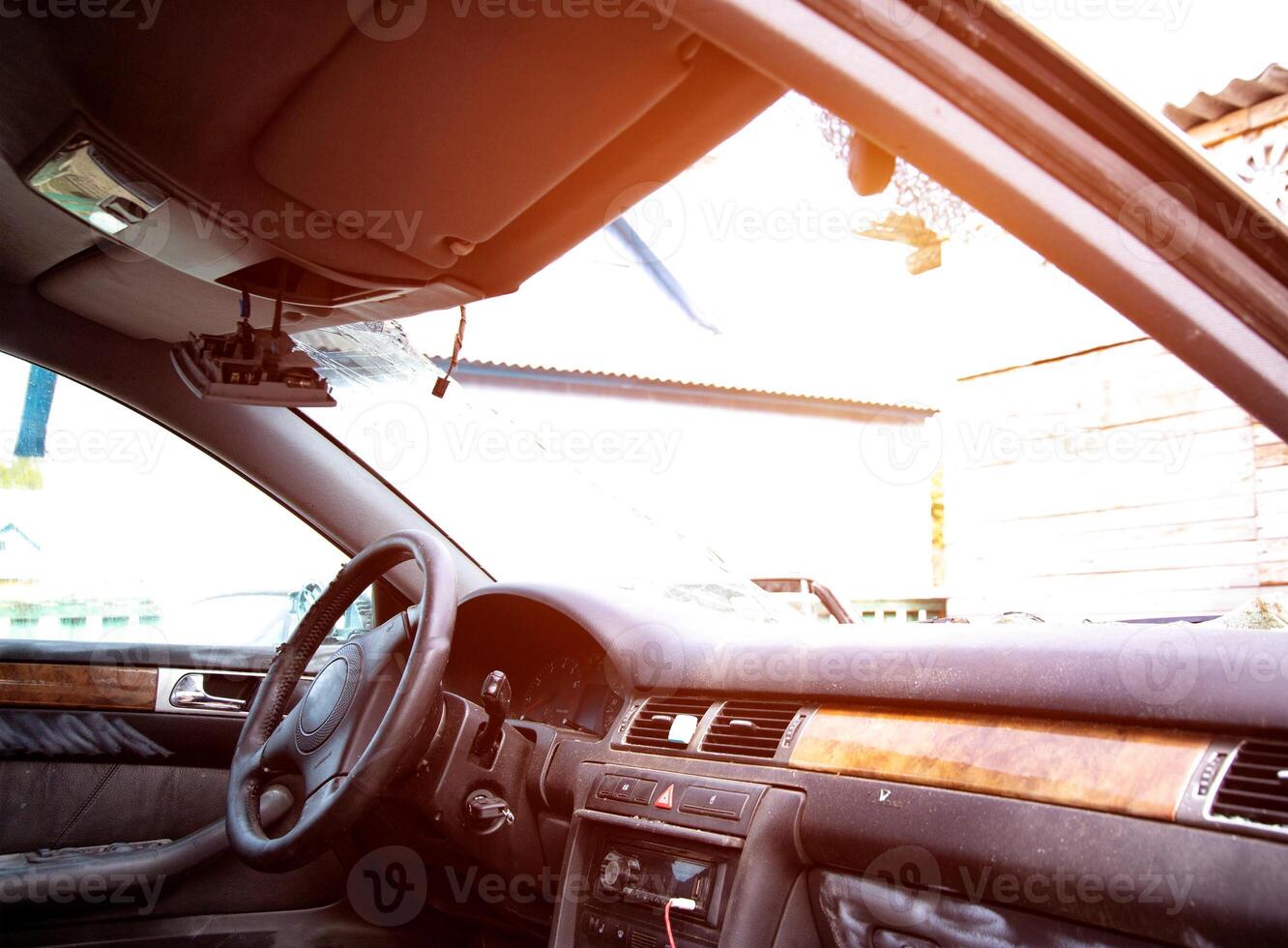 Broken windshield in a car after a collision with a pedestrian and a car accident. Road safety, car insurance photo