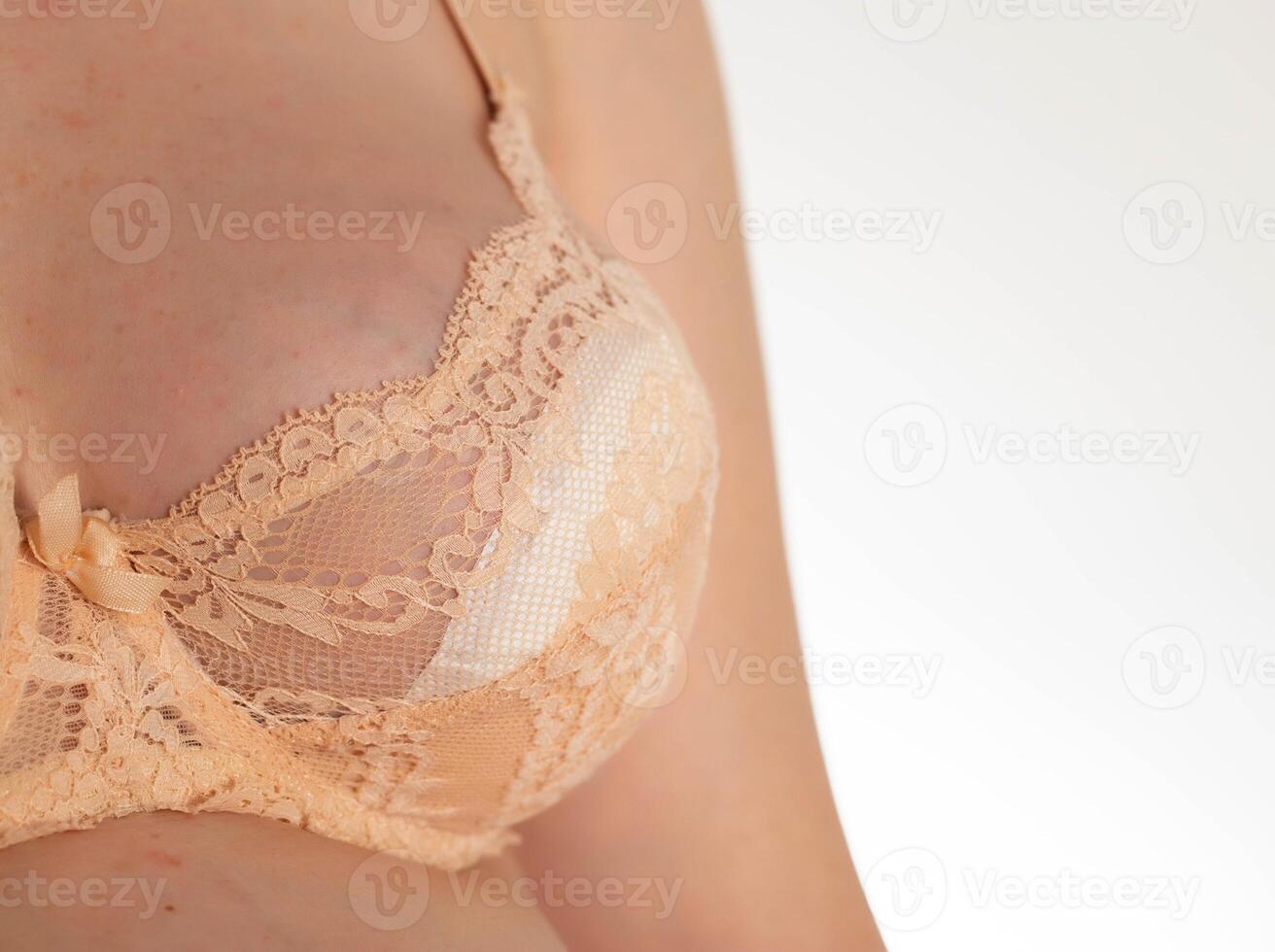 Bra on the female breast with special inserts to protect the female breast from getting wet with milk, close-up photo