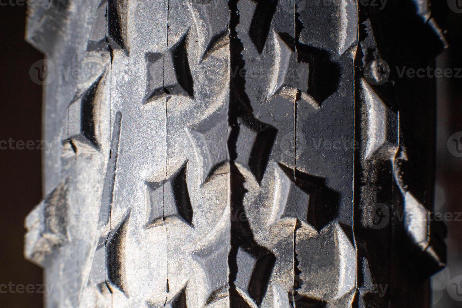 tread on a bicycle off-road tire, background, macro photo