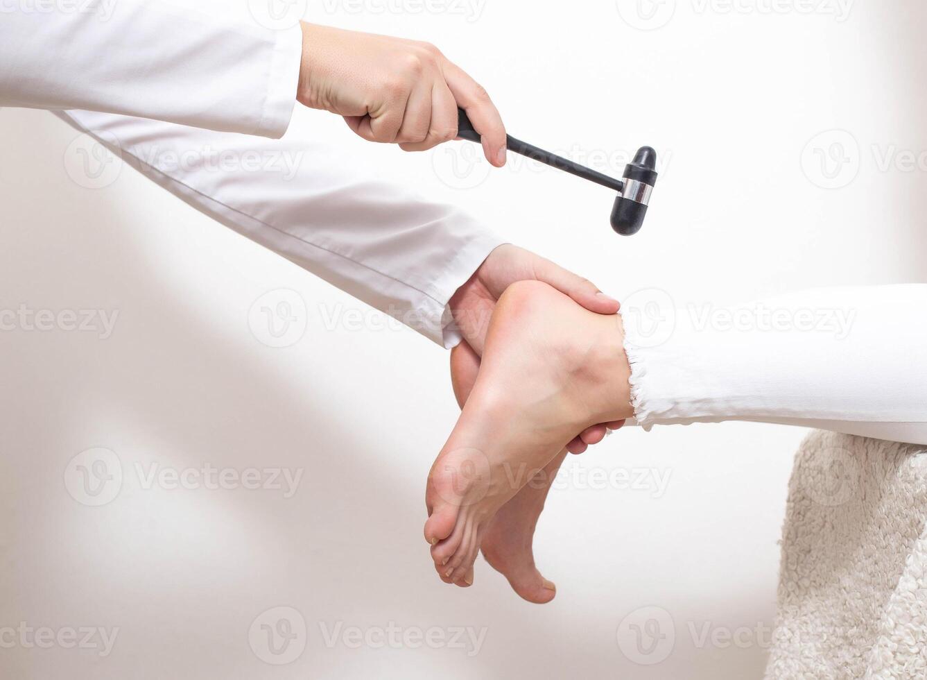 Checking the patient's Achilles reflex for the presence of a compressed nerve with injuries of the spine and spinal cord of an intervertebral hernia, copy space photo