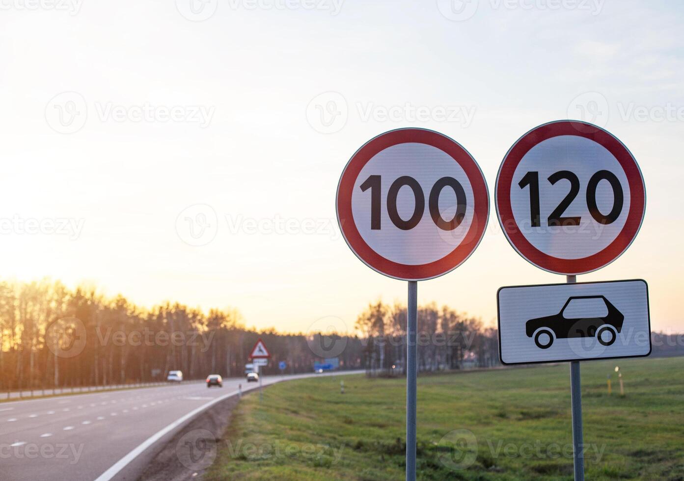 Traffic signs limit the maximum speed on the motorway. Speed and Safety Compliance Concept, copy space photo