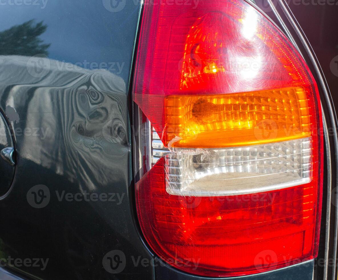 damage to the taillight of the car, accident. Car insurance, background, close-up photo