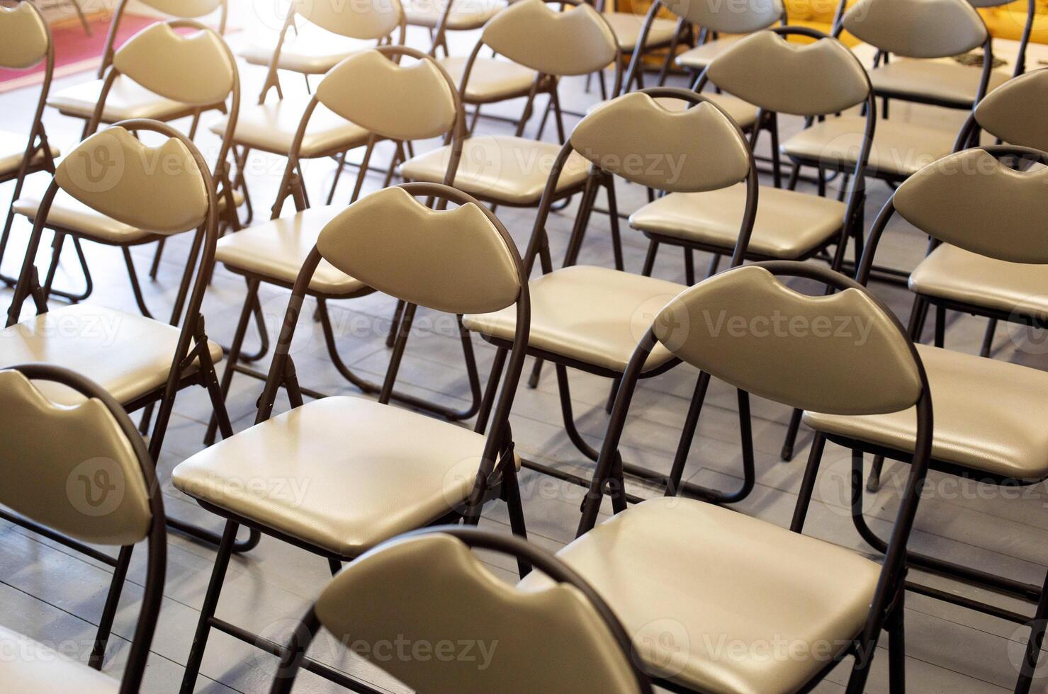 A background of comfortable modern chairs in the auditorium. Training and presentation concept, conference photo