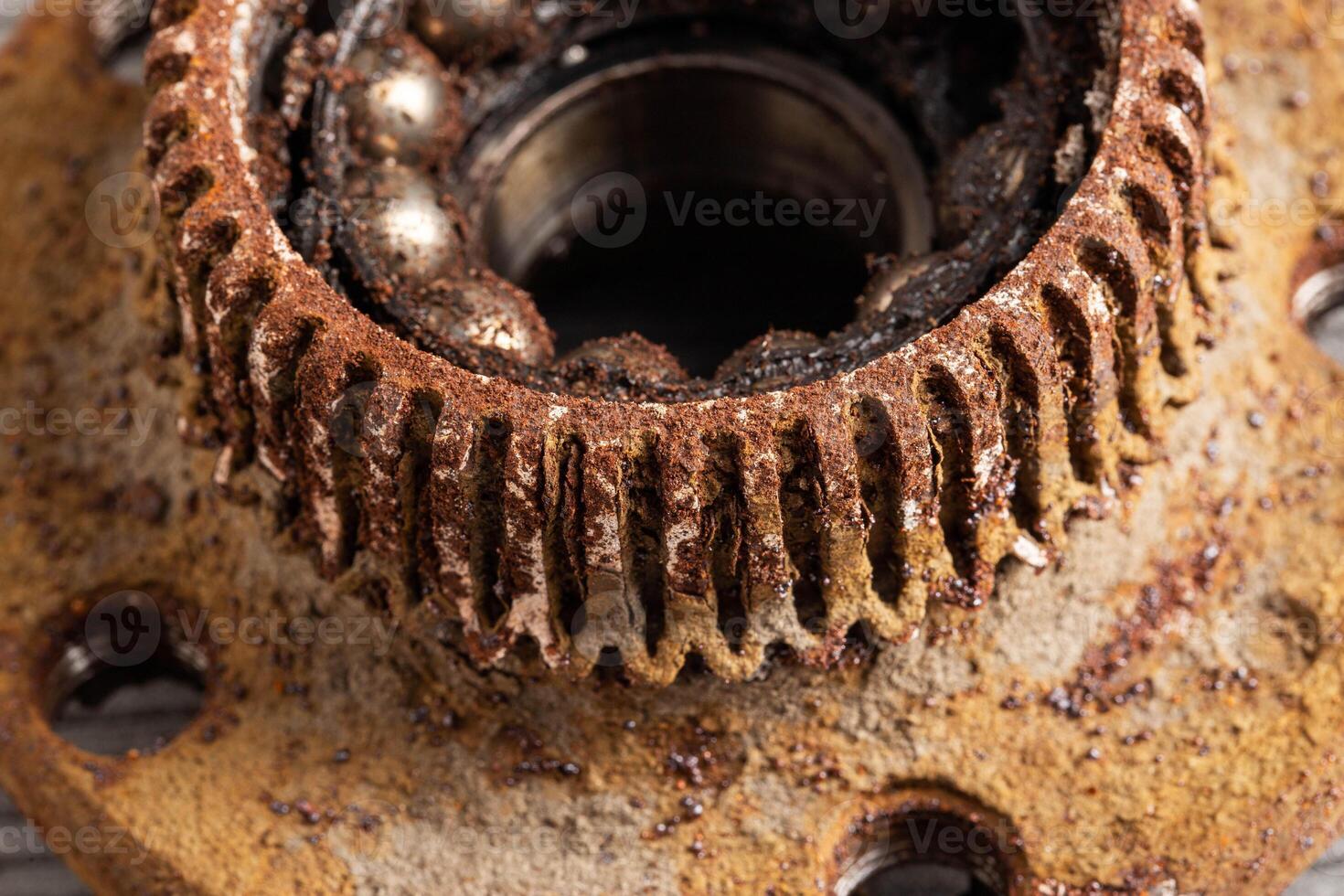 Old rusty wheel hub with a broken bearing. Bearing jamming. Automotive Part, close-up. photo