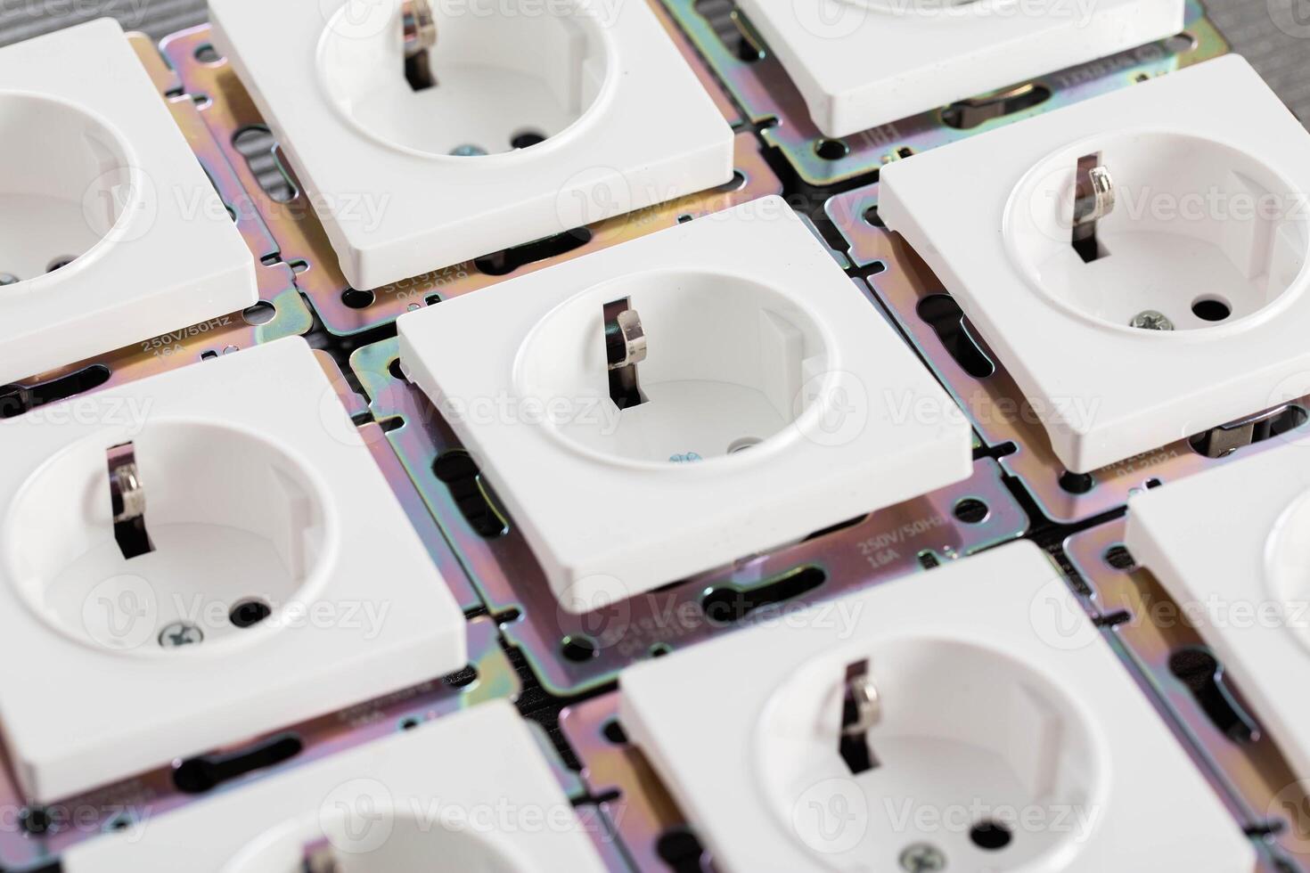 Background from home electric sockets, close-up. The concept of tariffs and prices for electricity photo