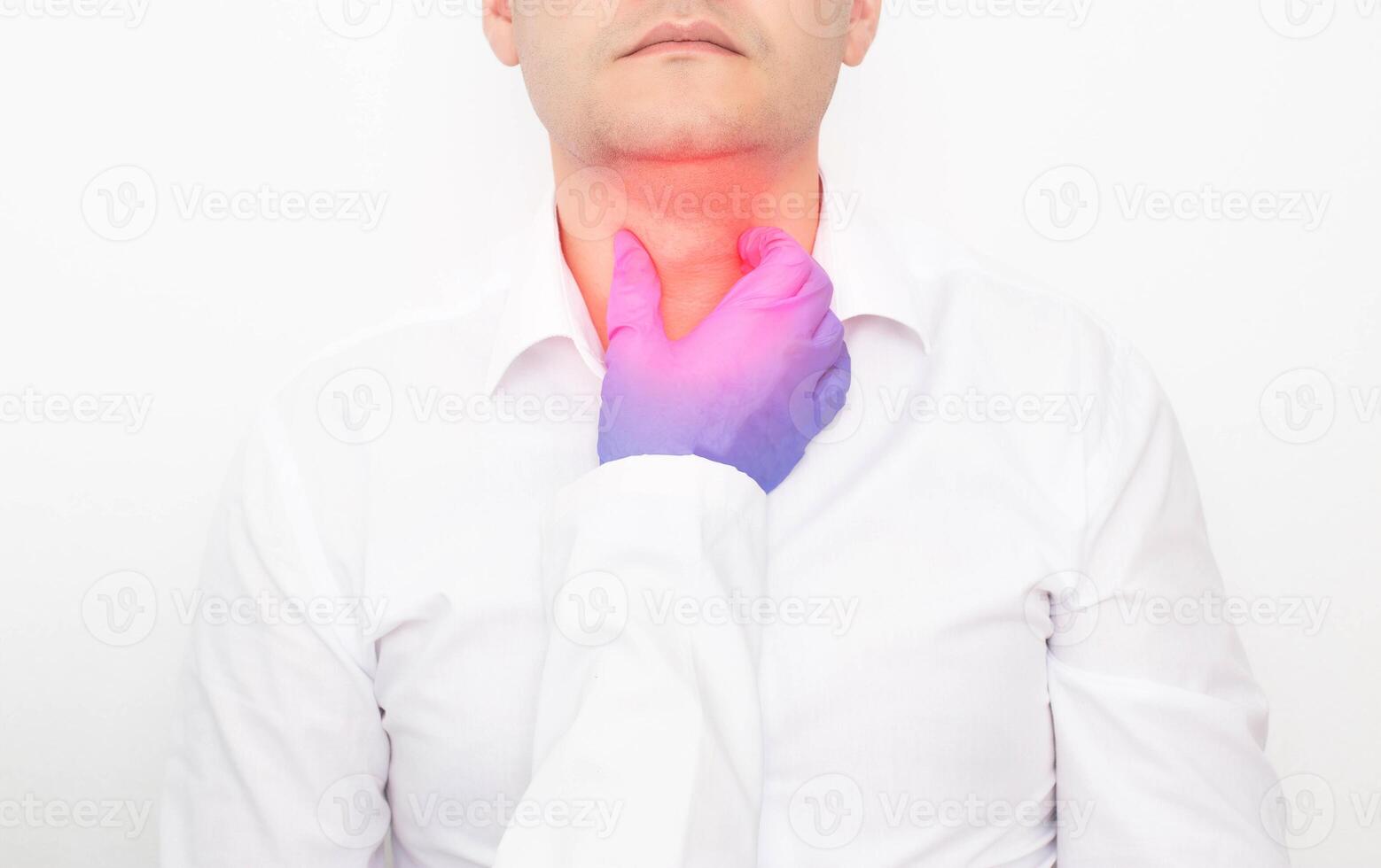 The doctor checks during the examination of the thyroid gland in a man on a white background. Concept of Thyroid Disease in Men, Nodular Goiter and Cancer, thyrotoxicosis photo