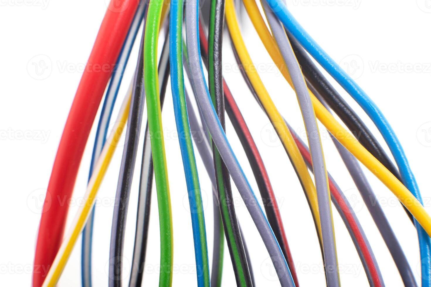 A lot of multi-colored electric wires on a white background. Solid wire with color insulation marked plus and minus, anti-short circuit, macro photo