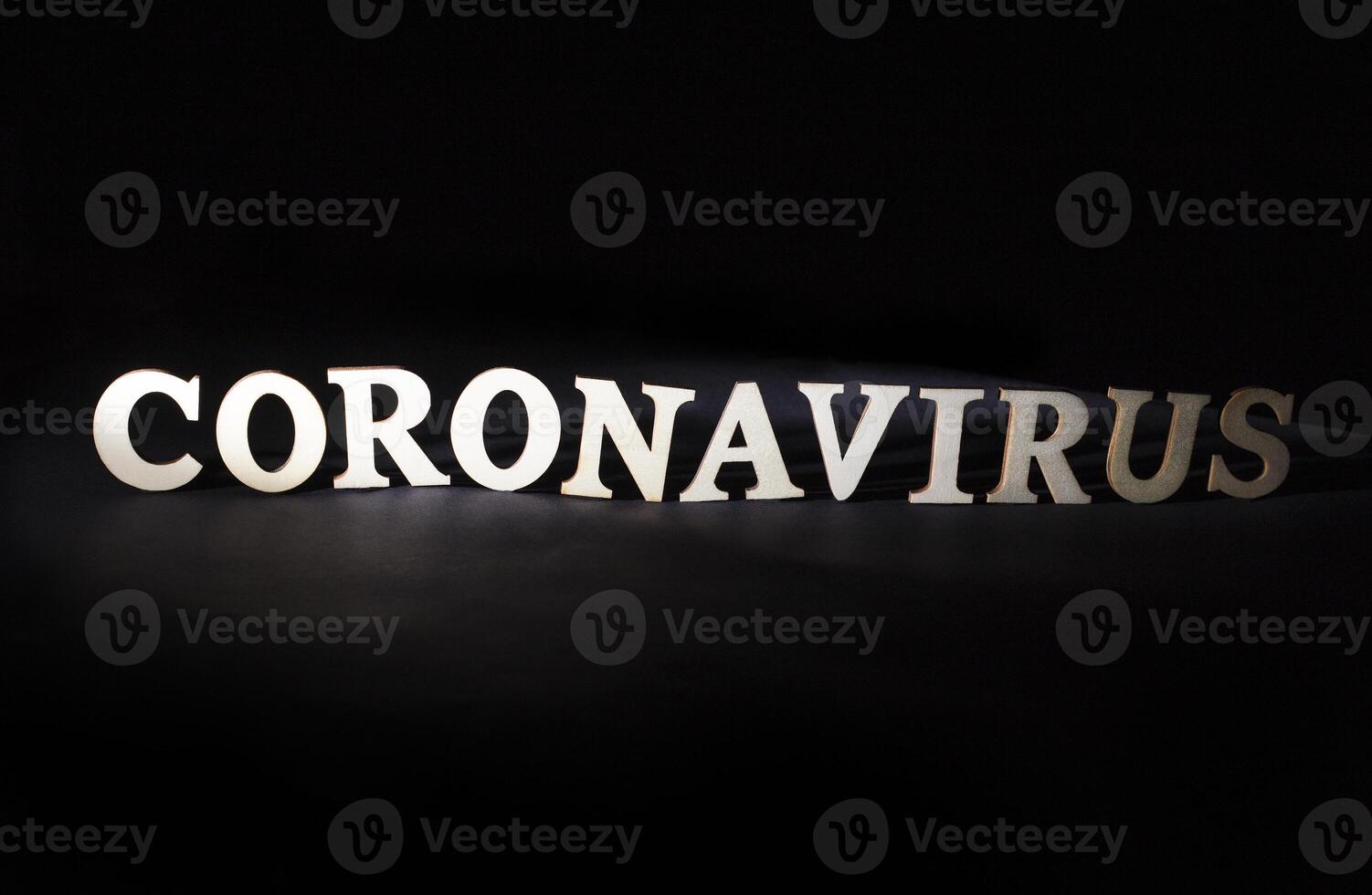 Word coronavirus on a black background. Deadly viral disease concept, medicine and vaccine for virus, dangerous photo