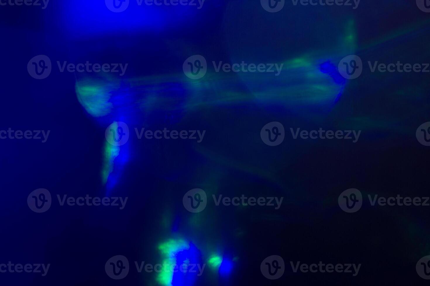 Blurred lens flare. Defocused colorful lights. Shiny glowing spots, abstract background and texture photo
