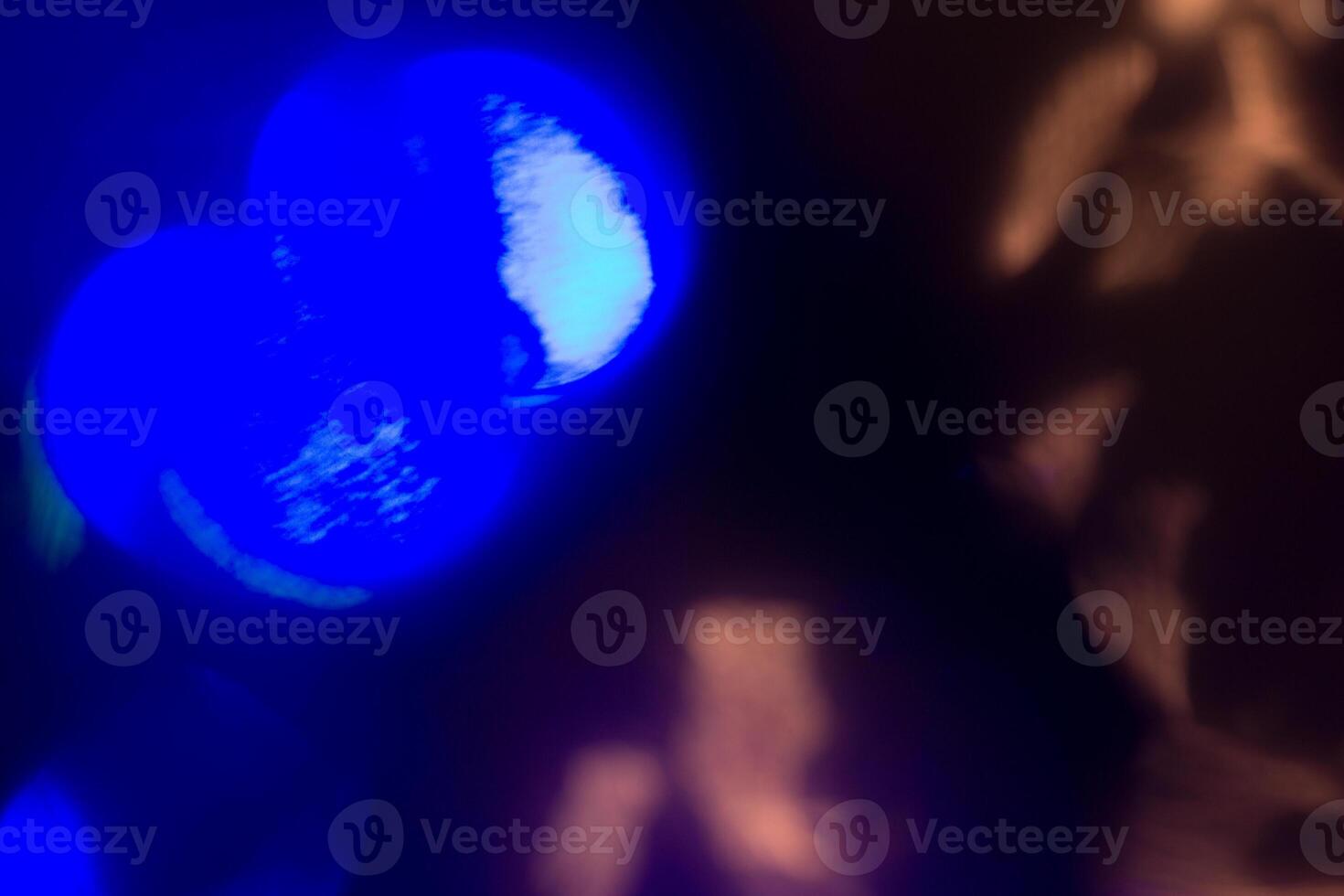 Blurred lens flare. Defocused colorful lights. Shiny glowing spots, abstract background and texture photo