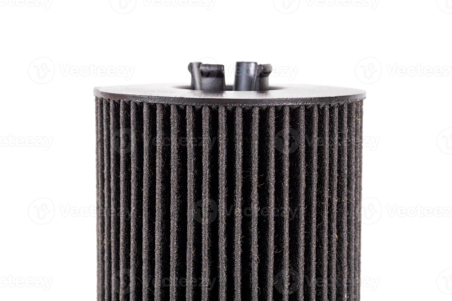 Car oil filter insert on white background, isolate. The concept of cleaning oil from dirt and impurities. Close-up photo