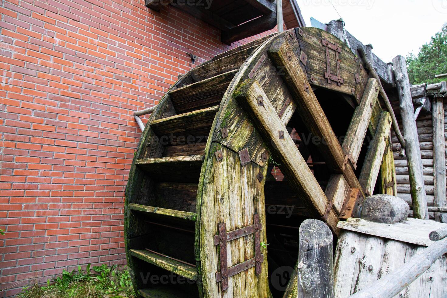 Old wooden water mill, antique style, background. Hydrotechnical photo