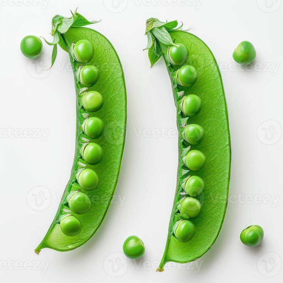 Two green pea pods in a row with seven individual peas forming the letter 'T' between them. photo