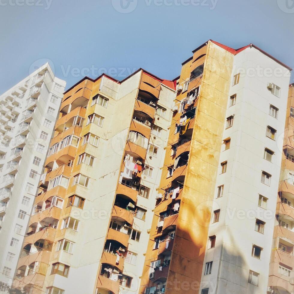 White and orange multistory residential building view. photo
