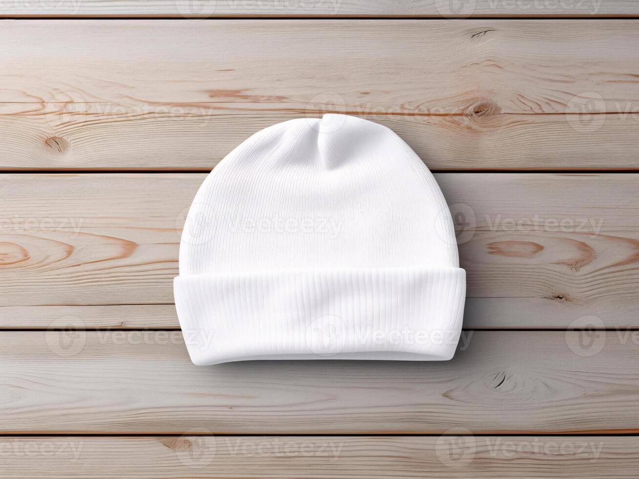 White baby hat mockup. Baby knitted bobble hat or beanie hat newborn clothing mock up on wooden background. photo