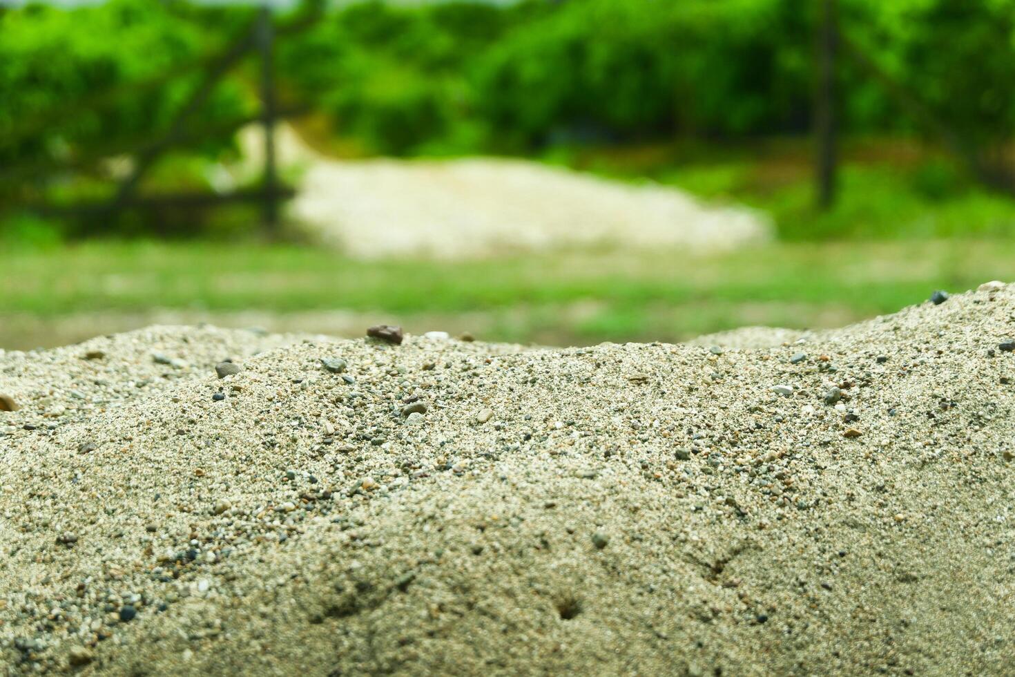 A pile of sand on a natural background is perfect for a summer-themed mockup photo