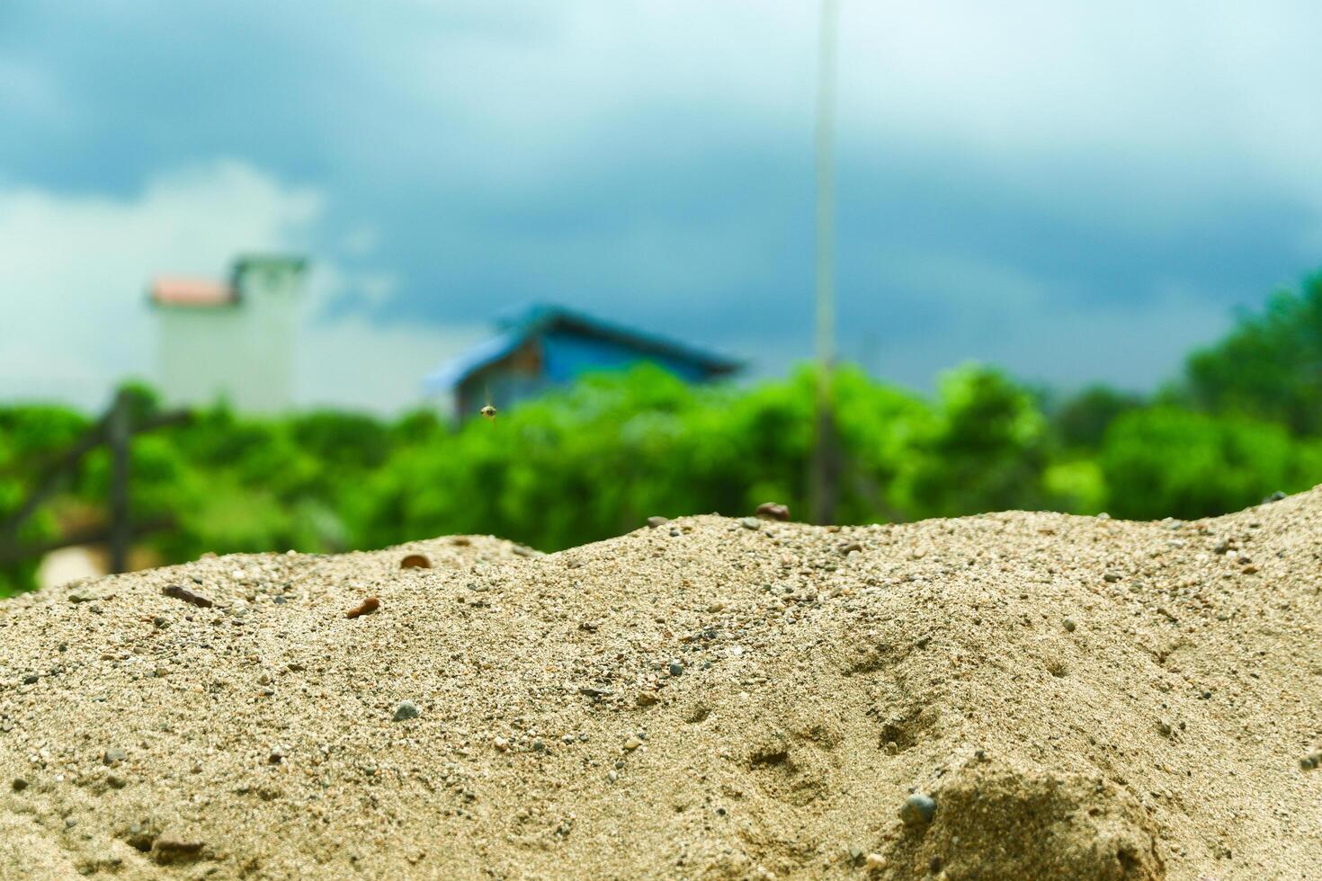 A pile of sand on a natural background is perfect for a summer-themed mockup photo