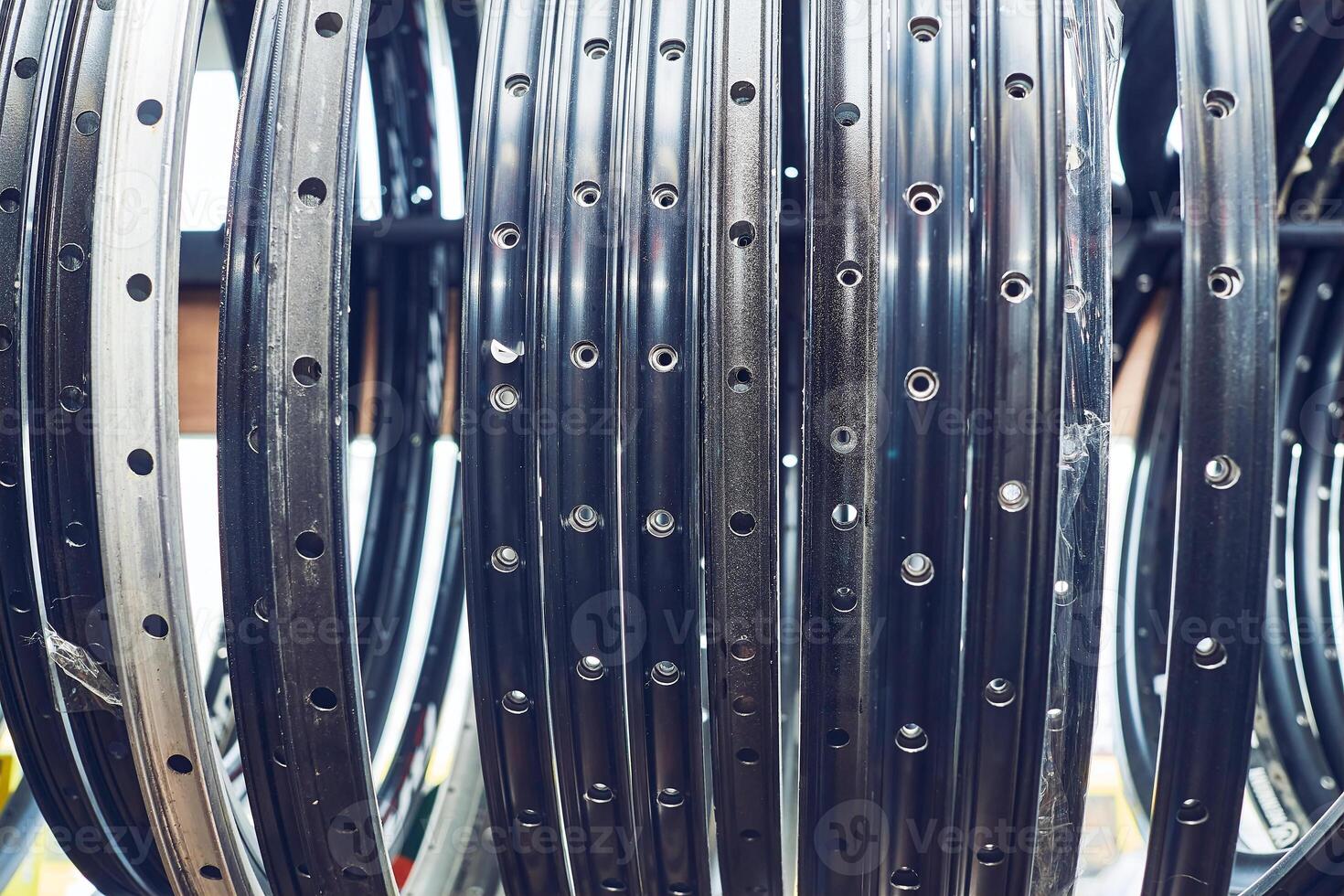 Repair shop.Metal rims of hanging bicycle wheels hanging photo
