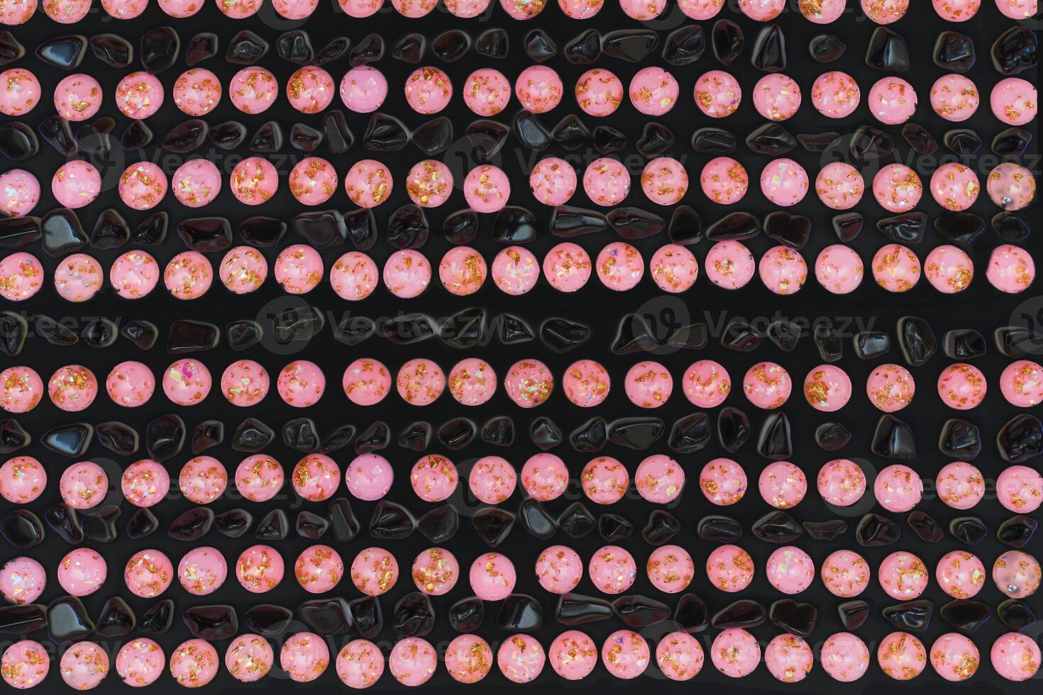 Black pink stones pebble round gems pattern photo