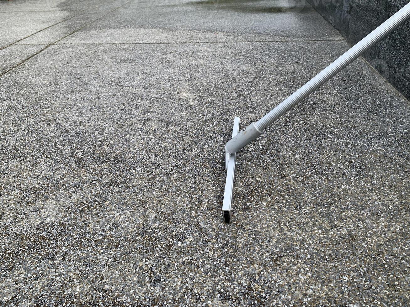 water mop equipment on floor background photo