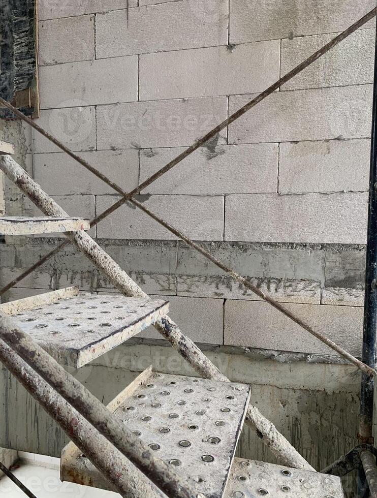 metal step worker in construction site background photo