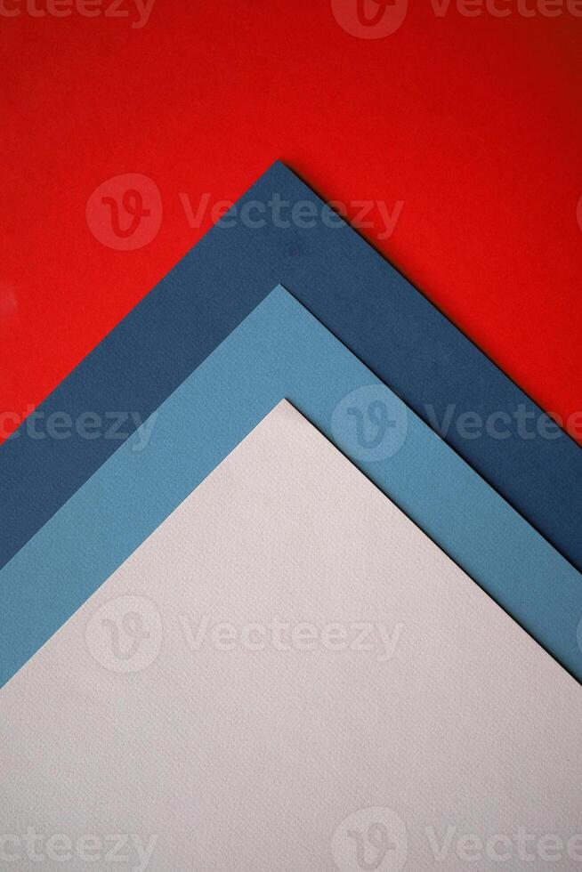 a red, white and blue triangle on a red background photo