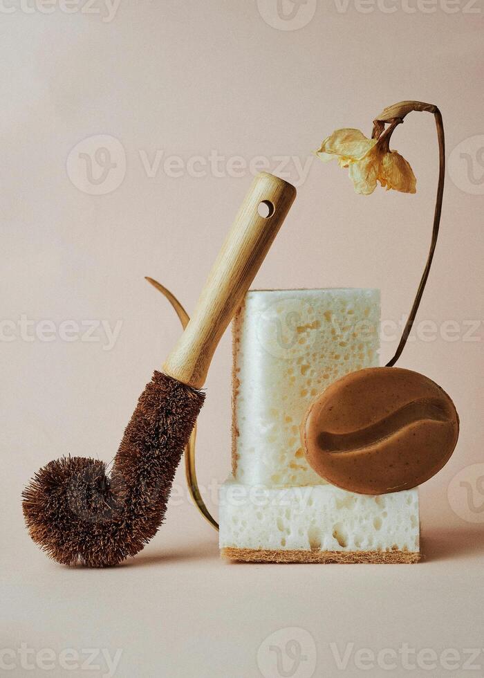 a wooden brush soap and a flower on a table photo