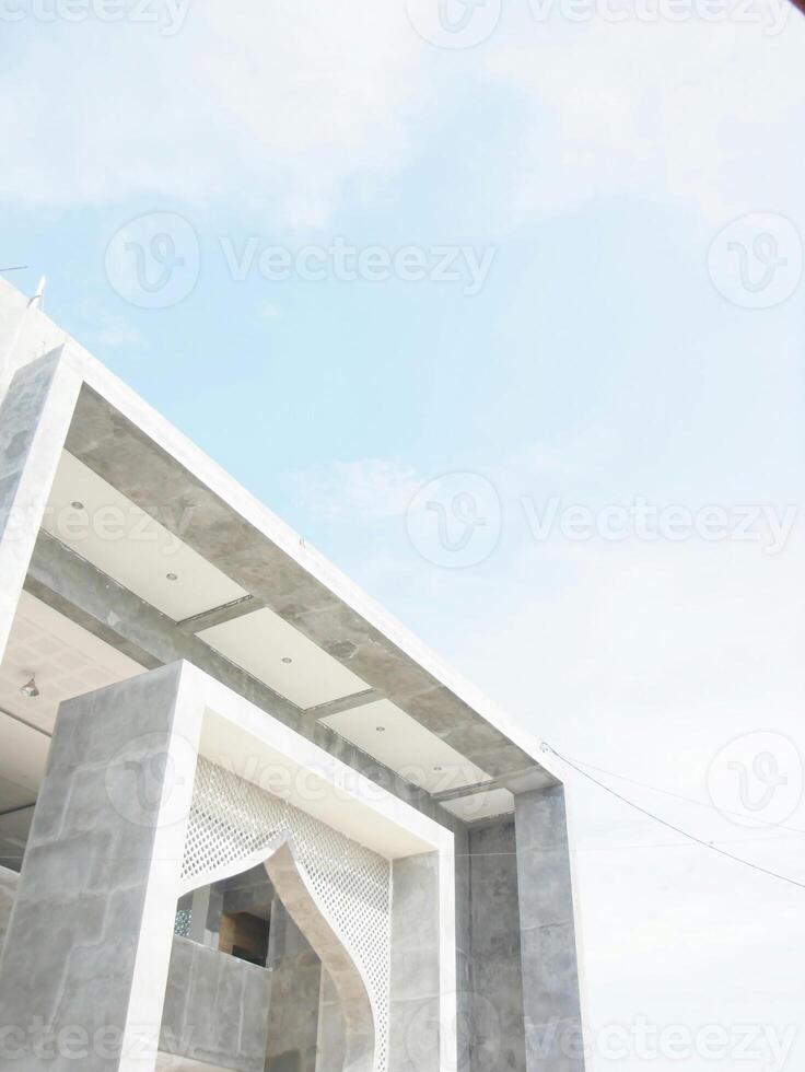a building with a white roof and a red sign photo