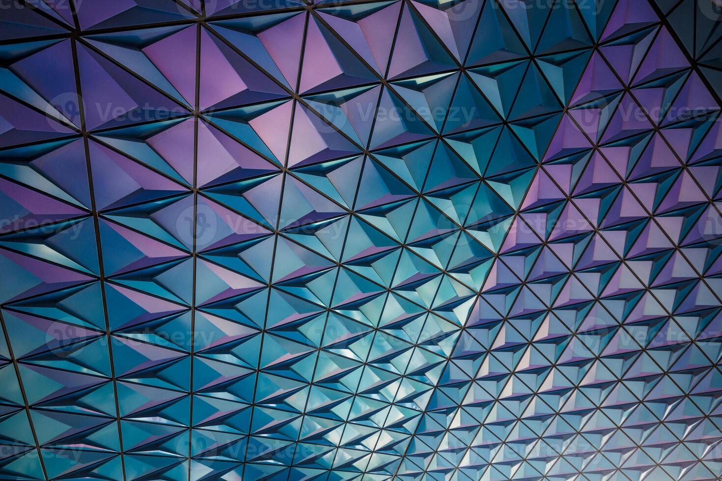the ceiling of a building is covered in triangles photo