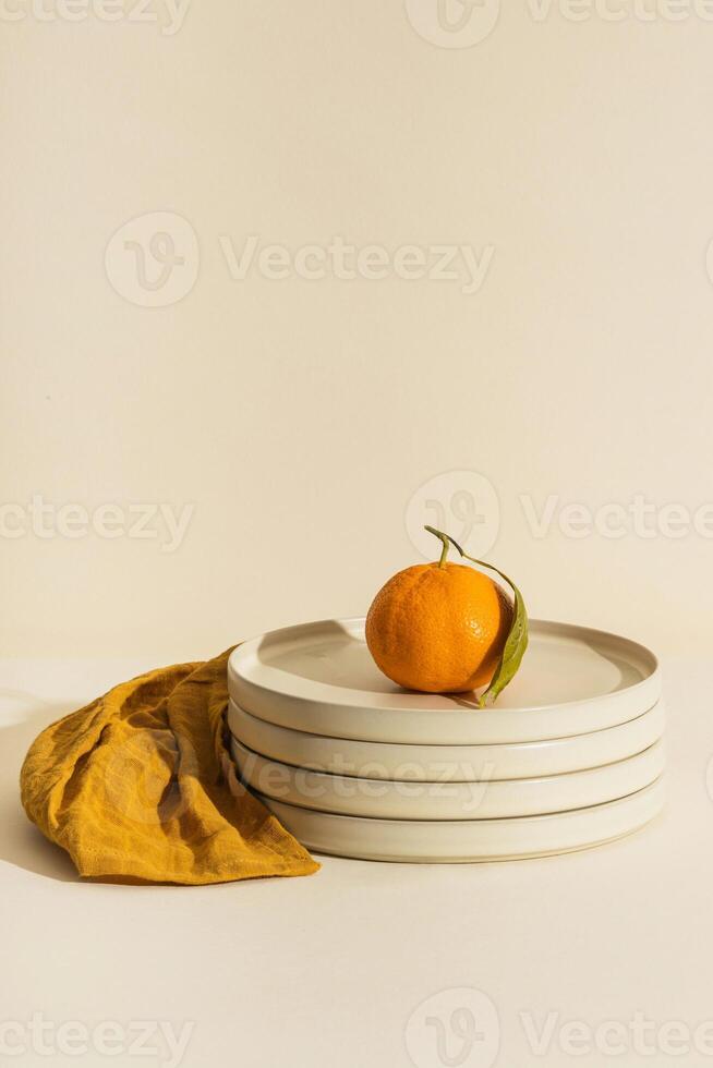a plate with an orange on it photo