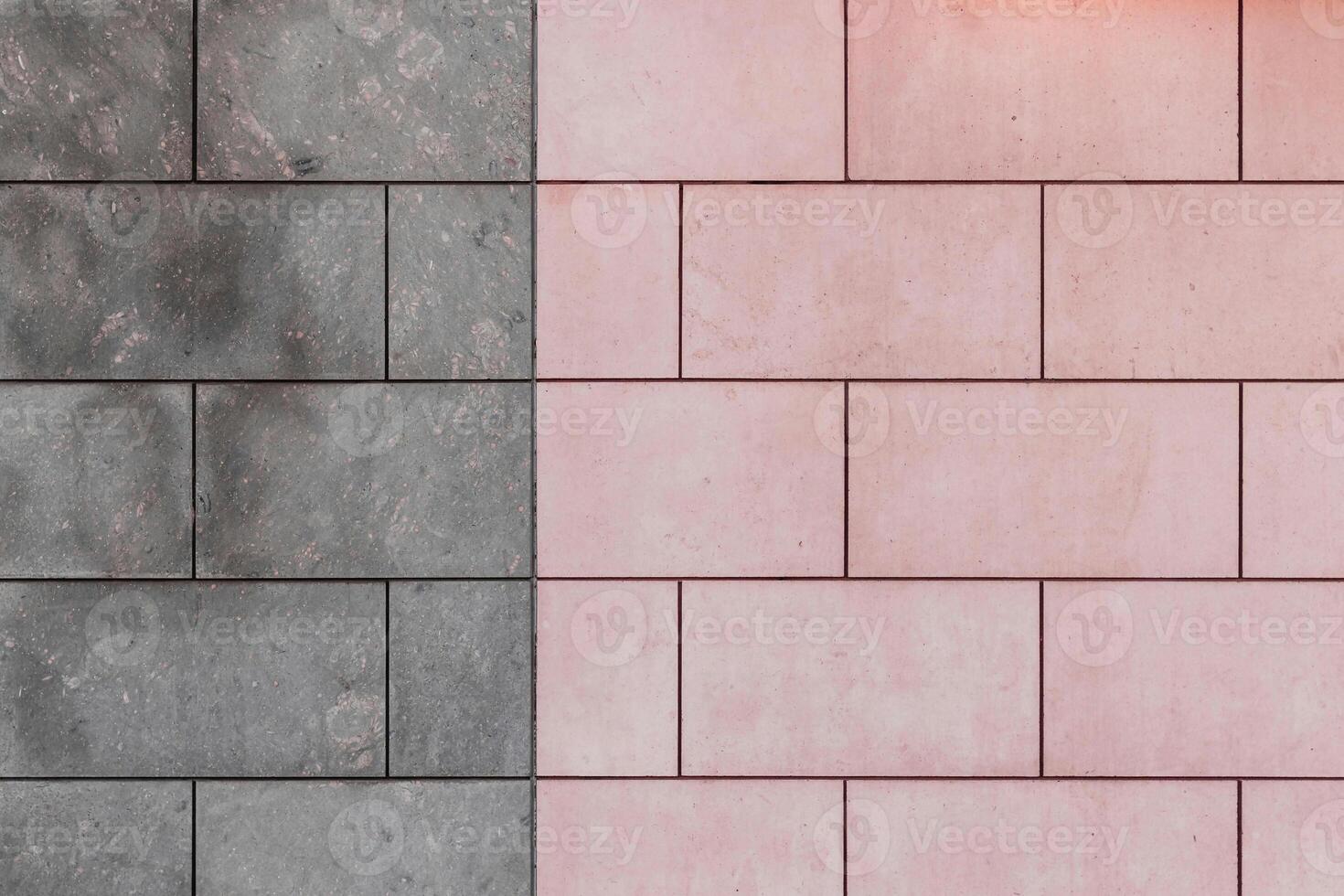 a pink and gray wall with a light on it photo