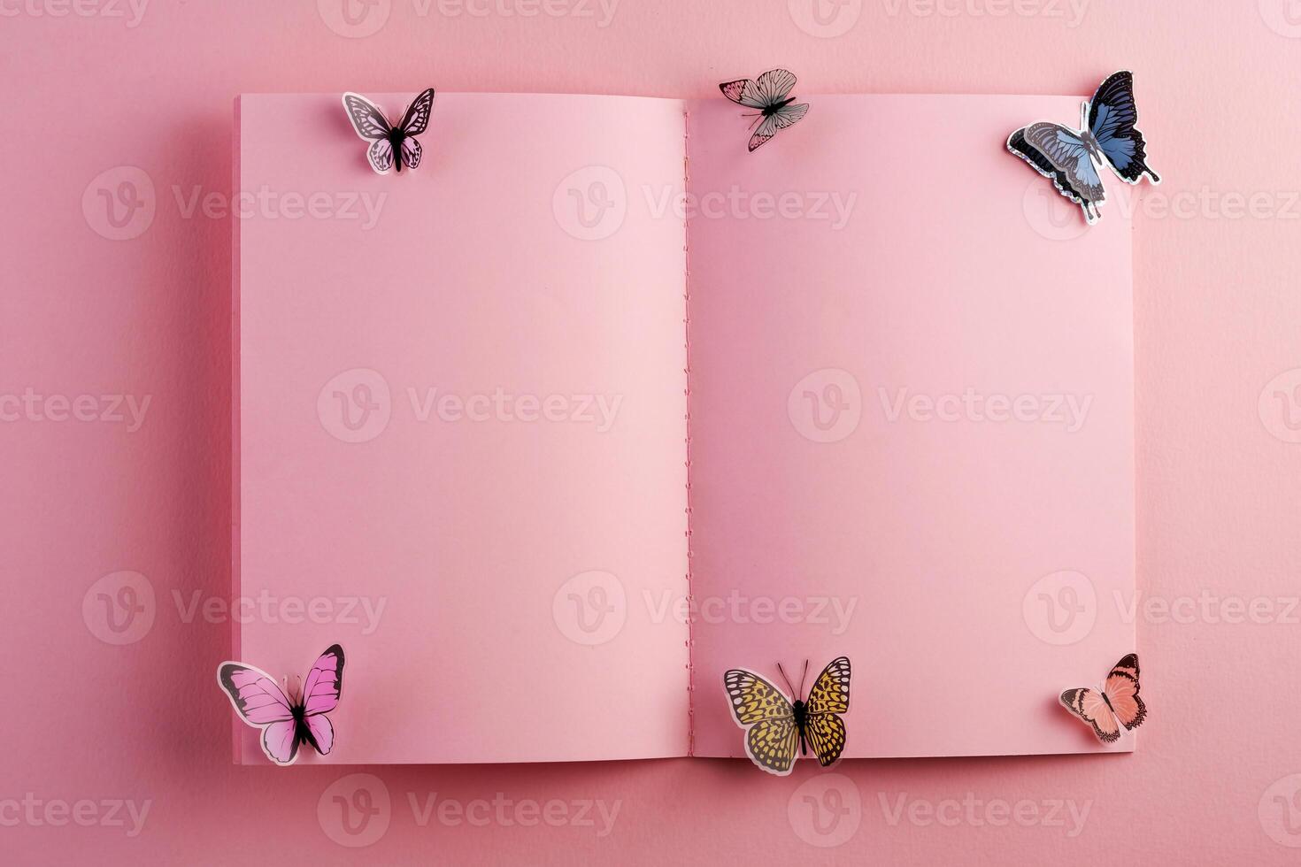a pink notebook with butterflies on it photo