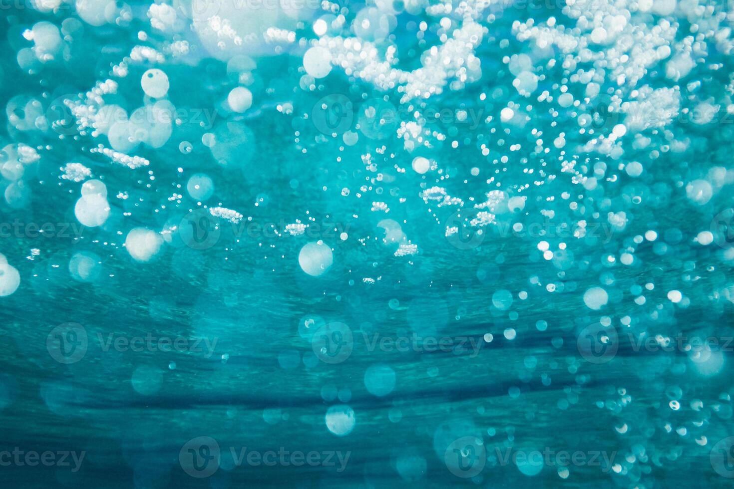 a close up view of bubbles in the ocean photo