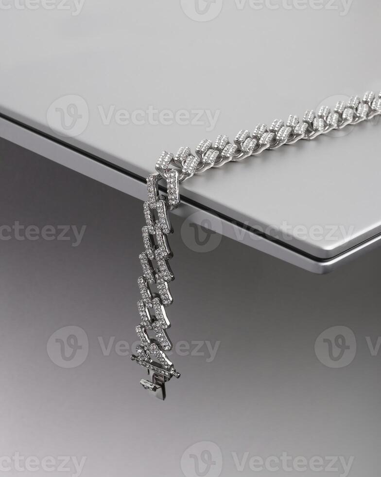 a silver chain with diamonds on it photo