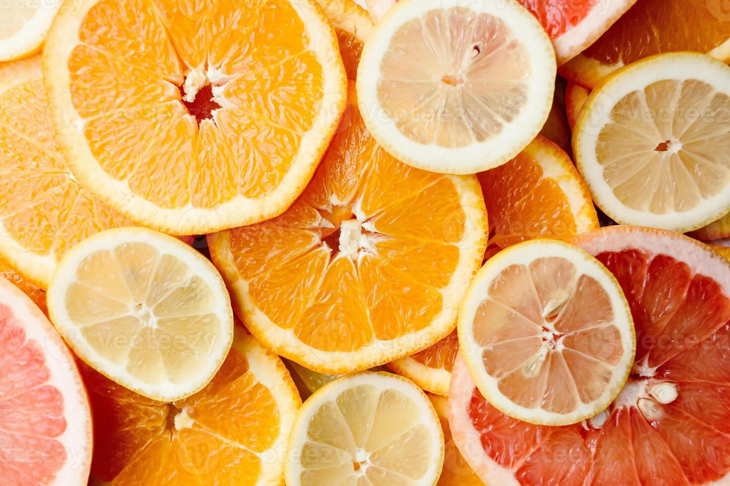a pile of sliced citrus fruits photo